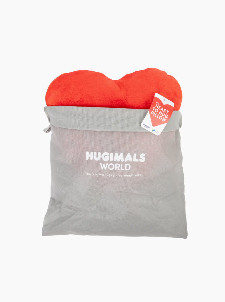 This image shows a red Heart to Hug Pillow emerging from a light gray Hugimals World gift bag.