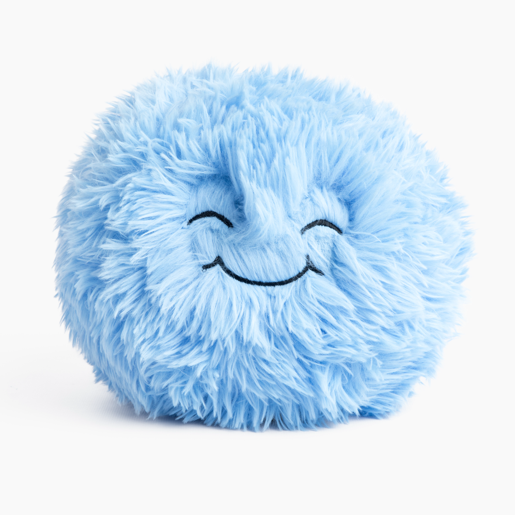 This photo shows the Blue Hug Pillow with it's "Sweet" expression facing forward, on a white background. The long blue plush looks cozy and its face looks very sweet!