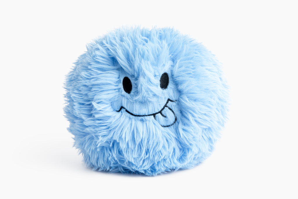 Photo showing the Blue Hug Ball on white background with it's "Silly" expression facing us