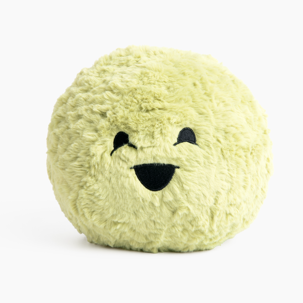 This image shows the Green Hug Ball, with its "Oh Yeah" face facing forward, on a white background. The ball is made of plush with embroidered facial features and is cute and cuddly looking.