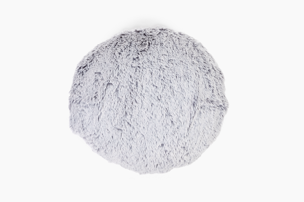 Image showing front of our round gray Hug Pillow on white background. The front has long, silky light gray plush