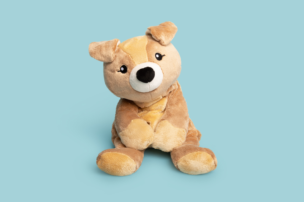 This photo shows Charlie the Puppy Hugimal in a cute seated pose on a teal background