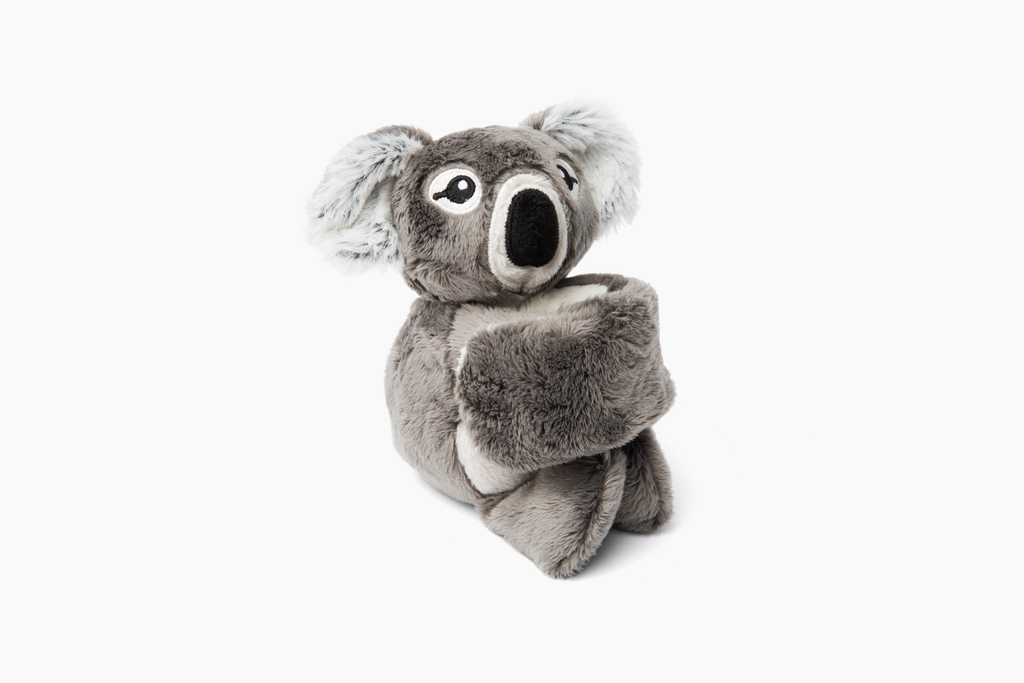This photo shows the Koala Hug Baby on white background with bracelet arms curled up.