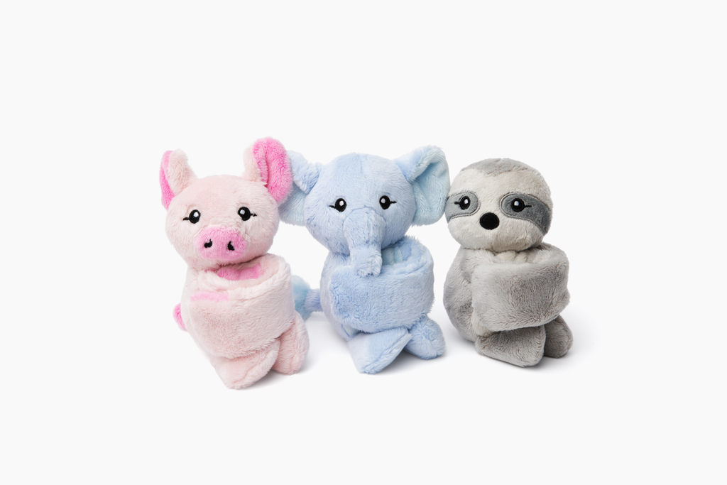 This photo shows three Hug Babies sitting with their arms curled up, on a white background: Pig, Elephant, Sloth