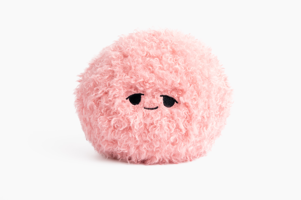 This photo shows the Pink Hug Ball on white background with "Sleepy" expression