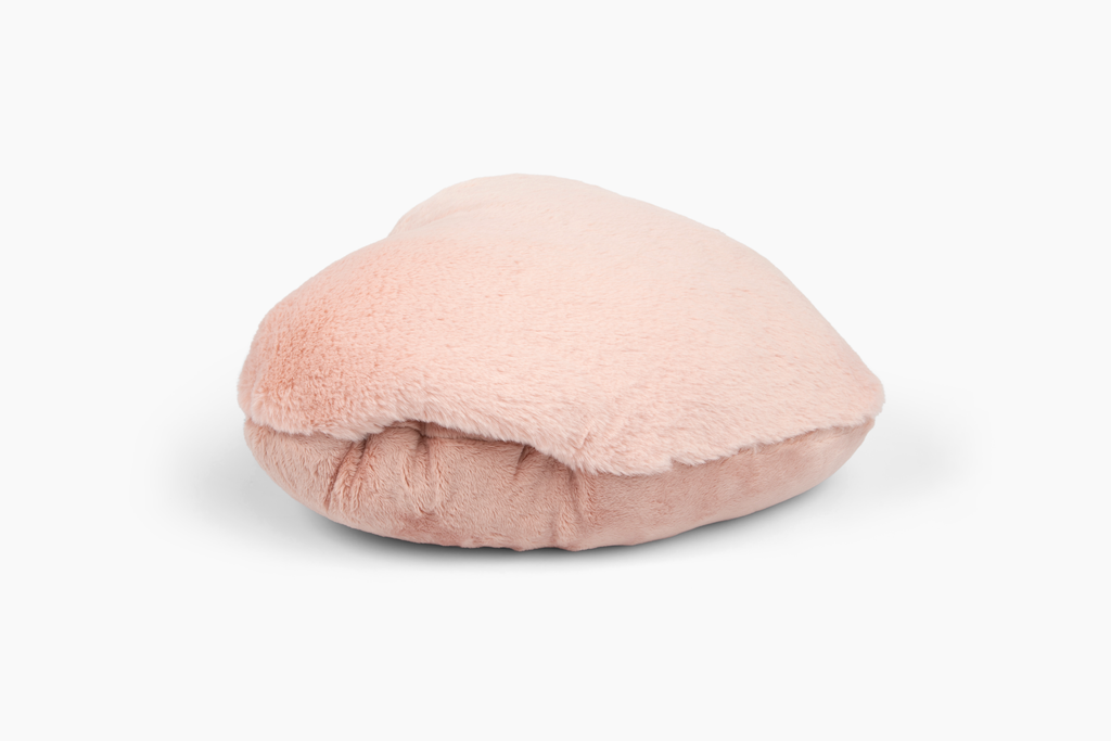 Image showing Antique Rose Super Sized Heart to Hug Pillow lying on white background. The hand pocket is visible from the side